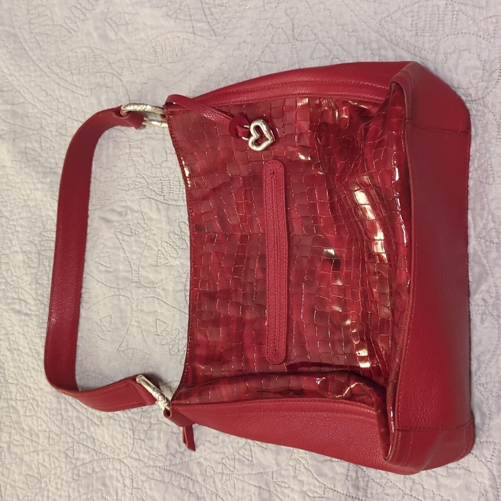 Red Brighton shoulder bag; the silver rings have some wear
